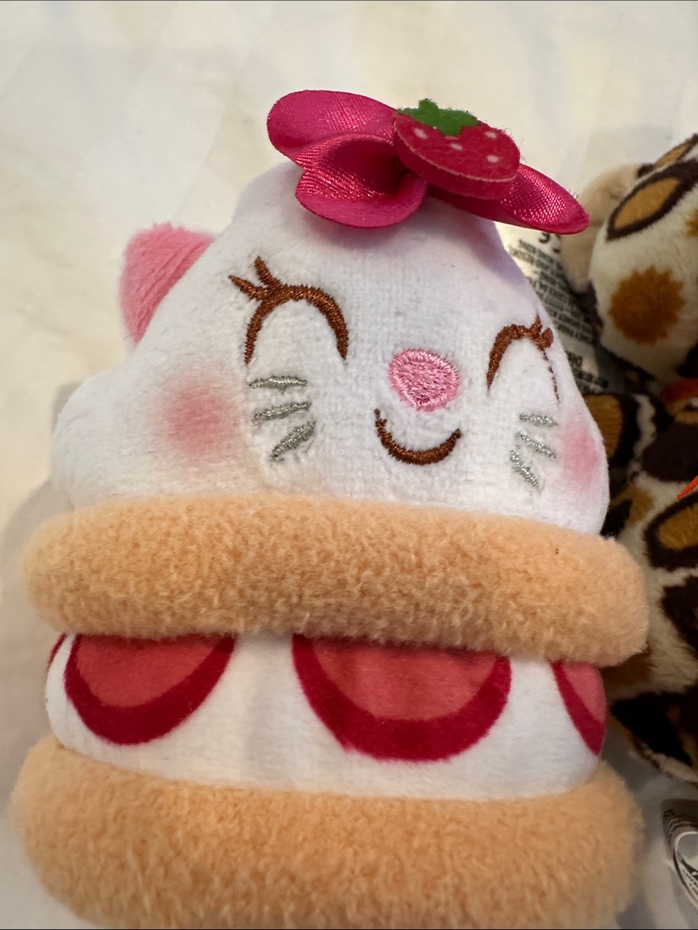 Disney strawberry shortcake, stuffed plushy and Reese’s pieces leopard plushy - Picture 2 of 9
